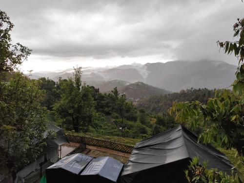 a view of the mountains from a house at Moonlight Camp Dhanachuli Mukteshwar in Nainital