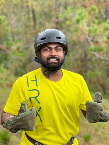 a man wearing a helmet and giving thumbs up at Moonlight Camp Dhanachuli Mukteshwar in Nainital