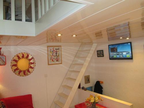 a staircase in a house with a living room at Romantic ideal young couple Portable aircon in Collioure