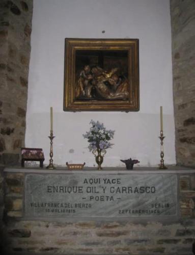 a painting on a wall above a tombestoneemetery at Hotel & Restaurante El Casino in Villafranca del Bierzo