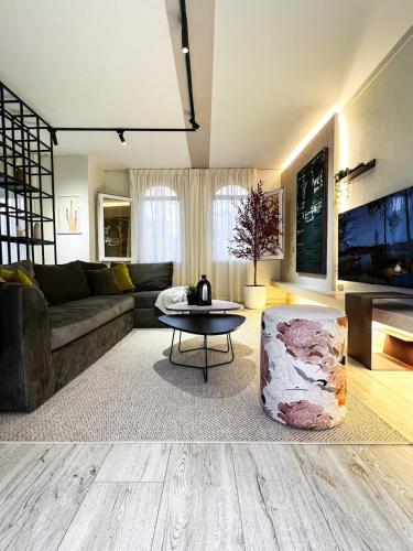 a living room with a couch and a table at 6th Of October Signature Stay in 6th Of October