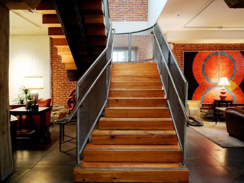 a staircase in a lobby with a stair case at Lancaster Arts Hotel in Lancaster