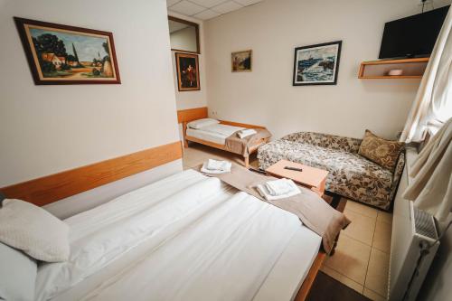 a living room with a couch and a table at B&B Passage in Sremska Mitrovica