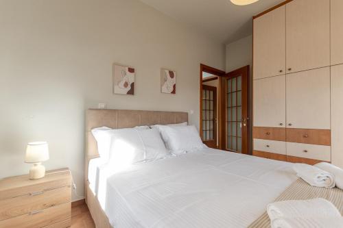 Ένα ή περισσότερα κρεβάτια σε δωμάτιο στο Melanes Serenity 3Br Apartment