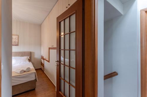 Ένα ή περισσότερα κρεβάτια σε δωμάτιο στο Melanes Serenity 3Br Apartment