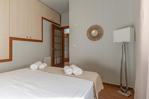 Ένα ή περισσότερα κρεβάτια σε δωμάτιο στο Melanes Serenity 3Br Apartment