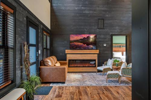 a living room with a fireplace in a house at Sunset in the Glades in Gatlinburg