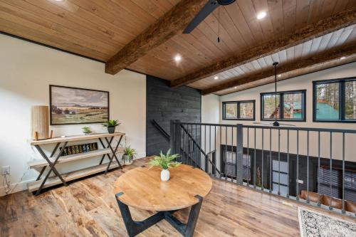 a dining room with a table and a staircase at Sunset in the Glades in Gatlinburg