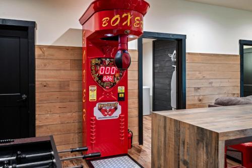 a red vending machine in a room with a table at Sunset in the Glades in Gatlinburg