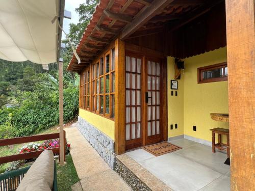 an outside view of a house with a wooden door at Miradouro São Pedro da Serra in São Pedro da Serra