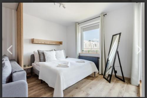 Ένα ή περισσότερα κρεβάτια σε δωμάτιο στο D'Ali apartamenty Daleka