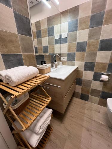 a bathroom with a sink and a mirror at Tirano center-325m dal Bernina Express in Tirano