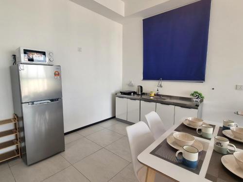 Cucina o angolo cottura di Cozy Minimalist Suite at Urban Suites Georgetown by SuperStay