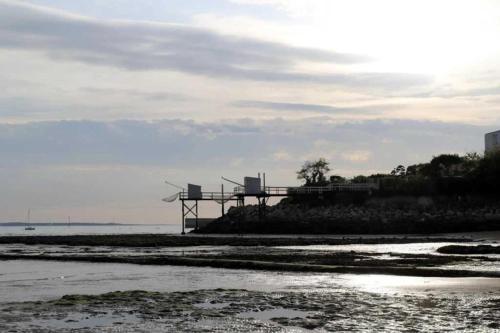 a building on the beach next to the water at Camping 3 étoiles - Piscine - ccaihff in Saint-Georges-de-Didonne