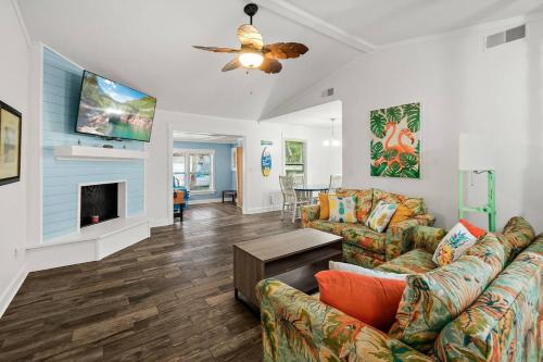 a living room with a couch and a fireplace at Dog-Friendly St. Augustine Retreat Near Downtown & Beach with EV Charging in St. Augustine