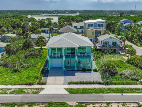 an aerial view of a house with a blue house at Oceanshore Oasis in Flagler Beach