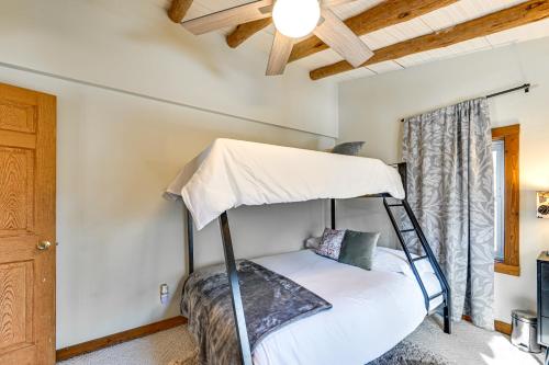 a bedroom with a bed with a canopy at Log Cabin Retreat in Kentucky Fire Pit and Grill! in Owensboro