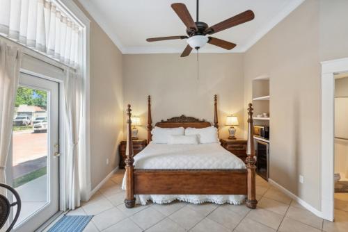 a bedroom with a bed and a ceiling fan at The Justin Room at The Eastland Historic Hotel in Eastland