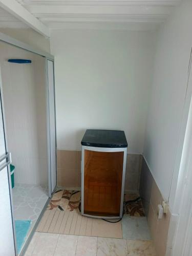 a small bathroom with a small cabinet in the corner at FINCA LA BENDICION in Santa Rosa de Cabal