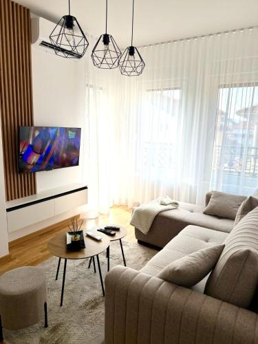 TV a/nebo společenská místnost v ubytování Apartman Relax