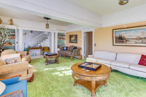 a living room with a couch and a table at Half-Mi to Atwood Lake Spacious Home! in Atwood