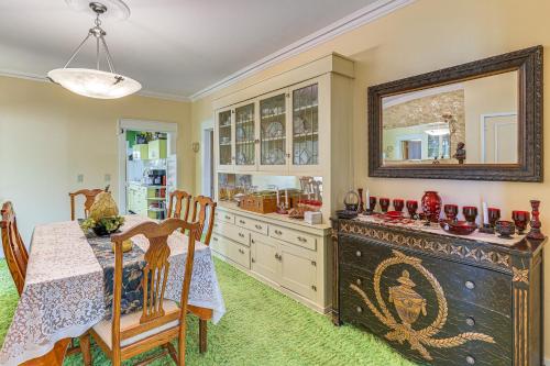 a dining room with a table and a mirror at Half-Mi to Atwood Lake Spacious Home! in Atwood