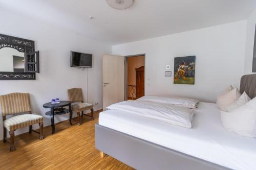 Postel nebo postele na pokoji v ubytování Hotel Freischütz