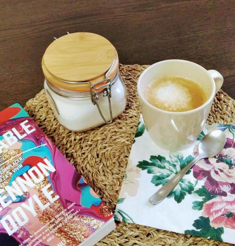 a cup of coffee and a jar of milk at Shui wu, la casita del agua in Geras