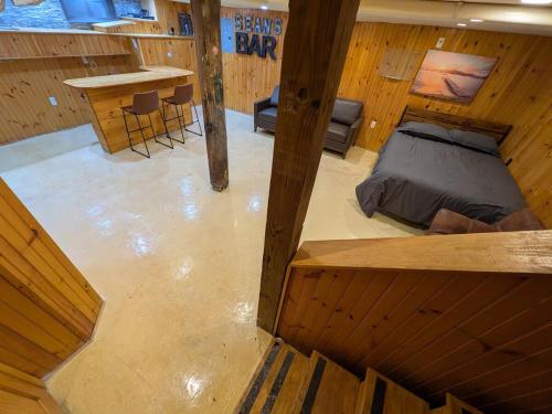 an overhead view of a room with a bed and a bar at Sean's Bar - Private Apartment in Winchester