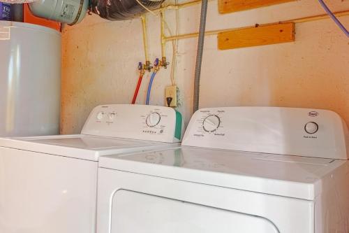 two washing machines sitting next to each other at Sean's Bar - Private Apartment in Winchester
