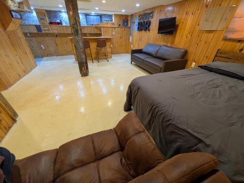 a large living room with a couch and a table at Sean's Bar - Private Apartment in Winchester