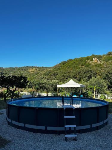 a swimming pool with a ladder in the middle at Melinda e Marlene in Ioppolo