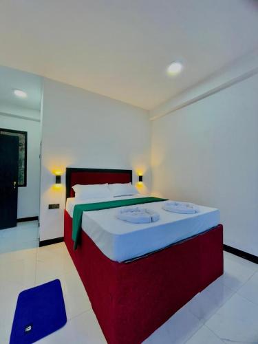 a bedroom with a large bed in a room at The Misty Mountain - Ella in Ella