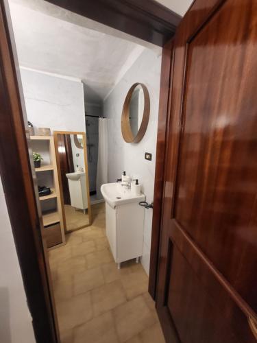 a bathroom with a sink and a mirror at Da Pietro e Sandra in La Spezia