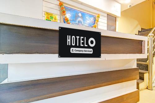 a shelf in a store with a hotel sign on it at Hotel O Hanuman Naka Ujjain Formerly Krishna Palace in Ujjain