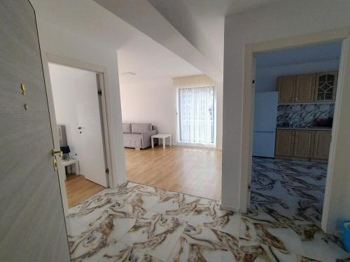 an empty living room with a large room with a floor at Patrick in Braşov