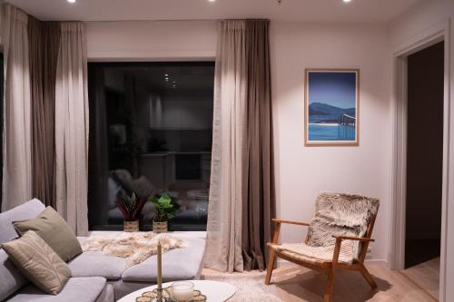 Et opholdsområde på Moderne leilighet ved sjøkanten