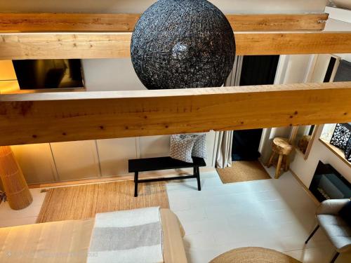 an overhead view of a living room with a table at A little Peace and Quiet in Wahlwiller