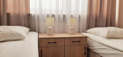 Postel nebo postele na pokoji v ubytování Hotel BOSiR