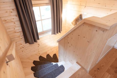 an overhead view of a tree house with a staircase at Feriendorf Koralpe Chalet Speik XL 27 in St. Gertraud