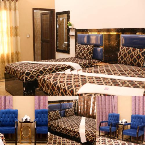 a hotel room with two beds and blue chairs at Royal Villa in Karachi