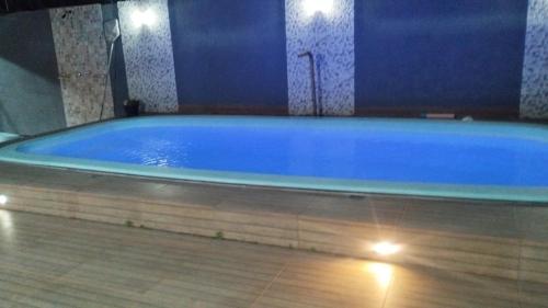 a large blue bath tub in a room at Casa de Alicia in Prado