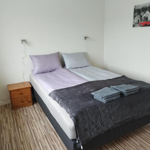 Postel nebo postele na pokoji v ubytování Hyggelig lejlighed i stille by