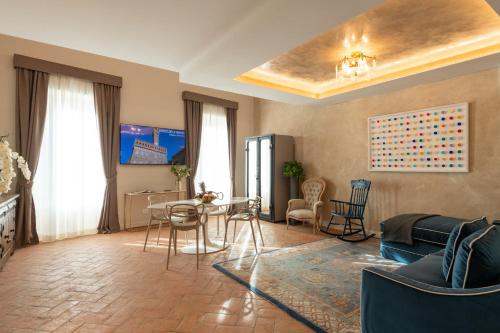 a living room with a couch and a table at Palazzo Doni by Florence Art Apartments in Florence