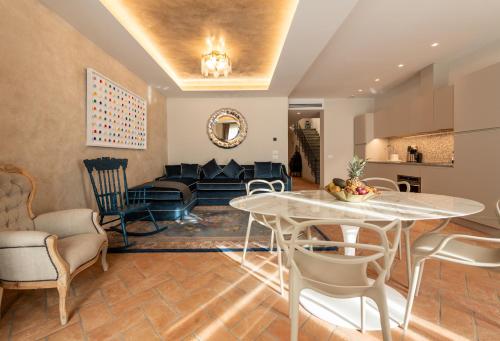 a living room with a table and a couch at Palazzo Doni by Florence Art Apartments in Florence