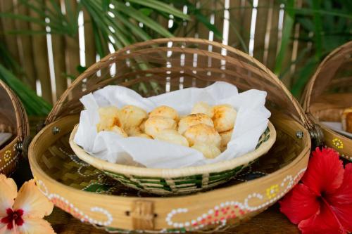 a basket of food sitting on top of a table at CasaLô Hotel in Jericoacoara