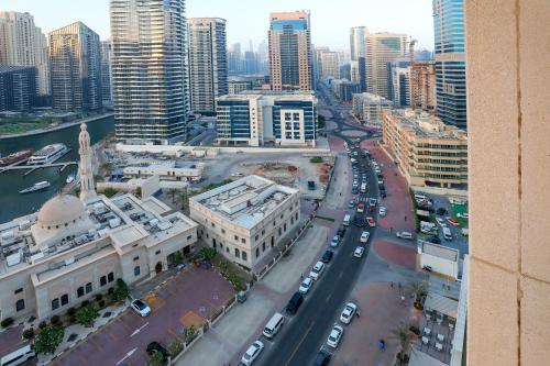an aerial view of a city with buildings and cars at LUXURY 1BED MARINA VIEW JBR BEACH POoL PARKING in Dubai