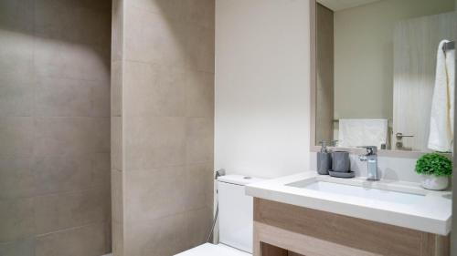 a bathroom with a sink and a shower at Luxury Villa In Yas in Abu Dhabi
