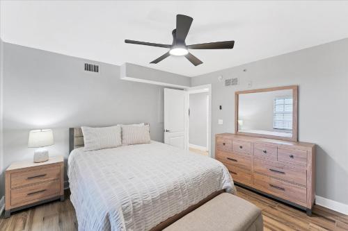 a bedroom with a bed and a ceiling fan at 50 Meredith #7 in Manasota Key