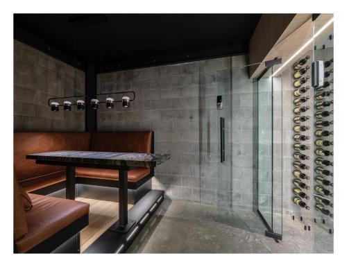 a dining room with a table and a wine cellar at Experience the Romance of The Historic Rouse House in Bozeman